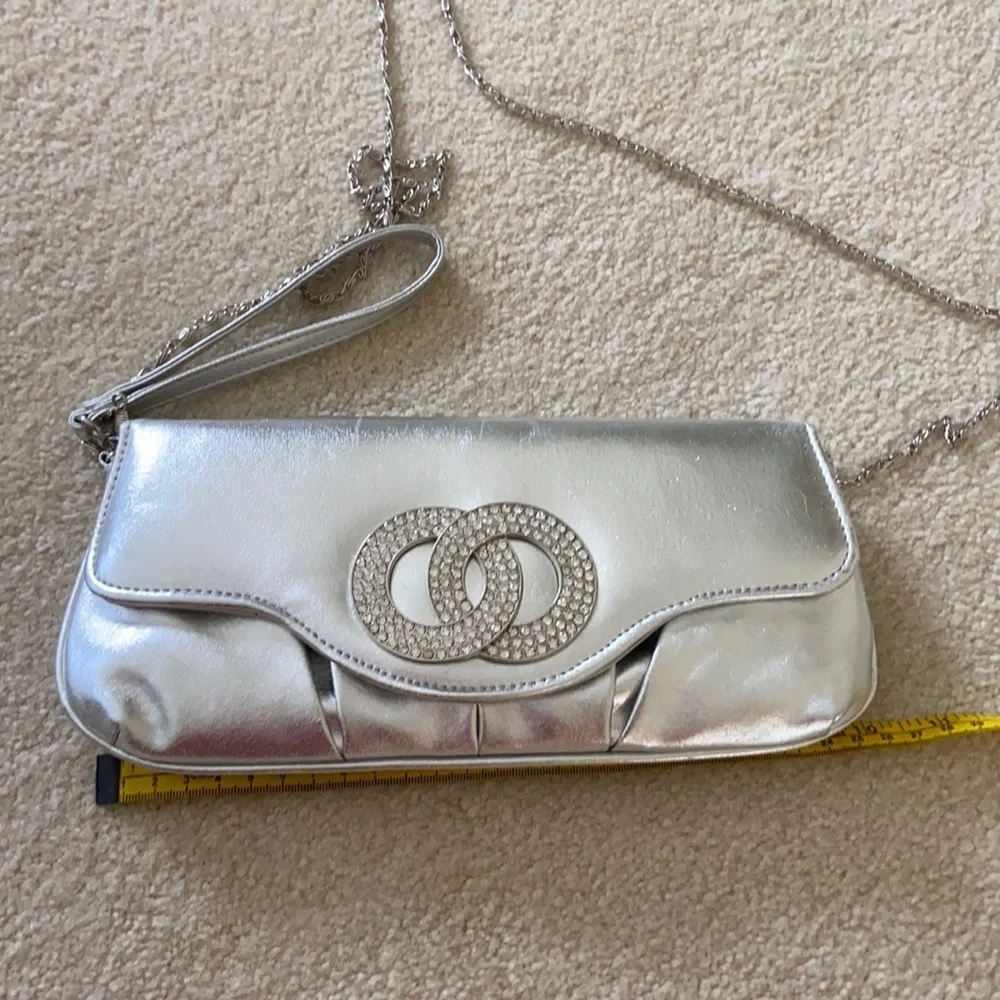 Silver clutch with removable chain and wrist strap